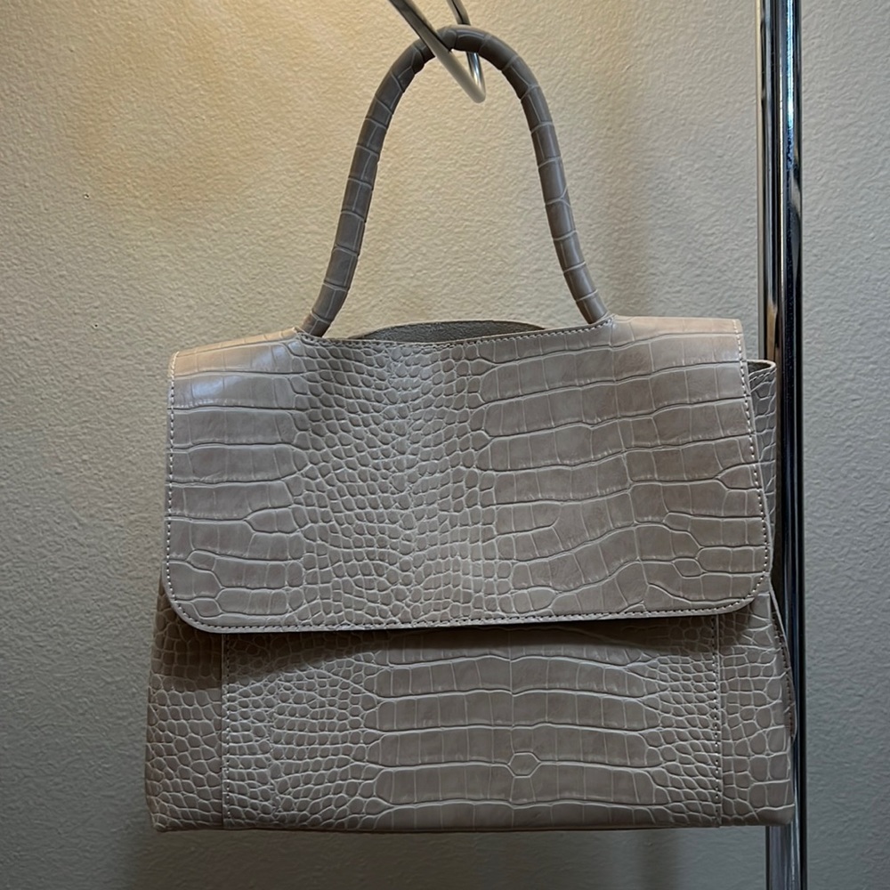 Never used-the bag still has a littleleather smell-not a genuine leather